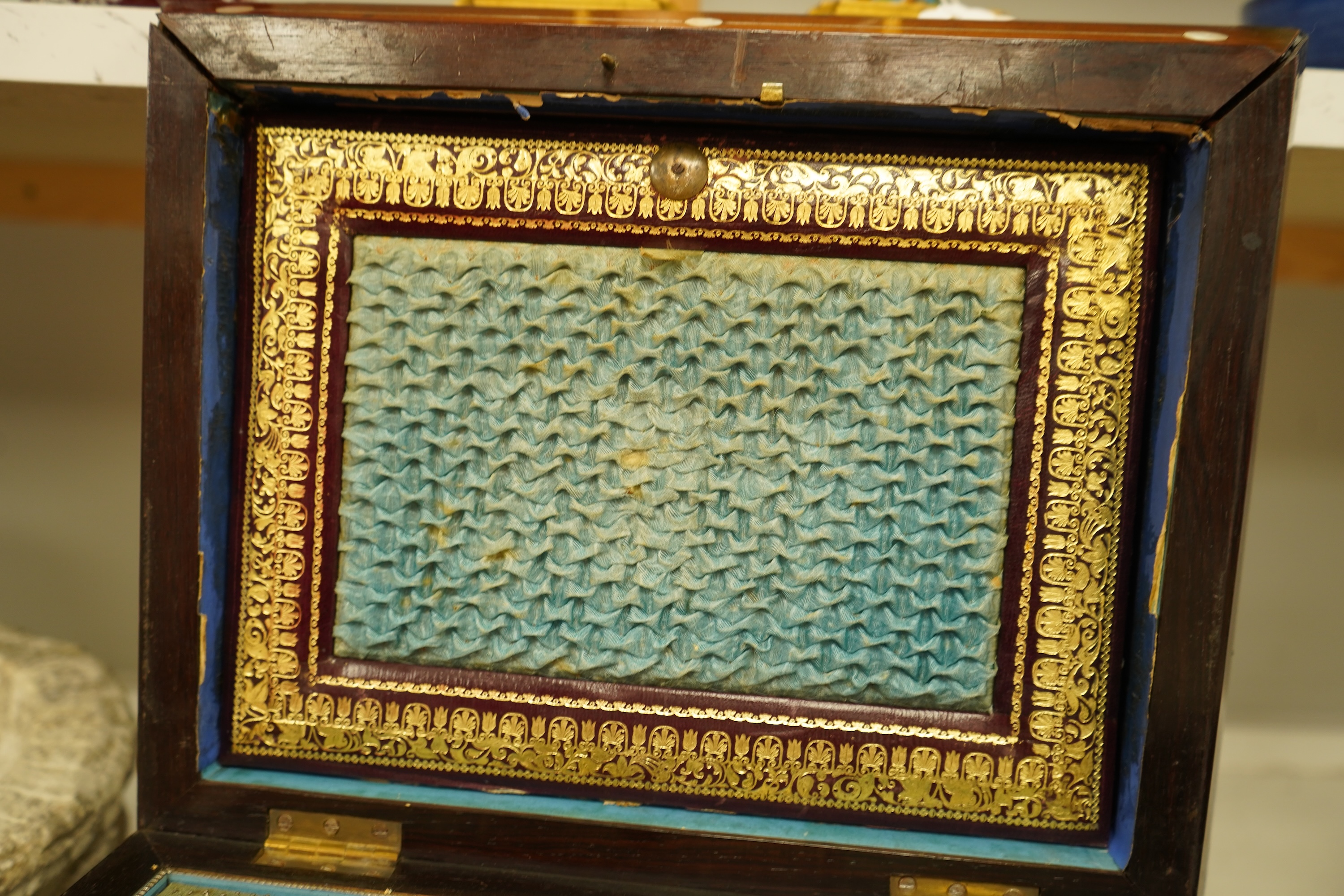 A William IV rosewood and mother of pearl inlaid sewing and writing cabinet with tooled Moroccan leather fitted interior, 37cm high